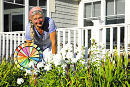 Woman in garden with sunwheel